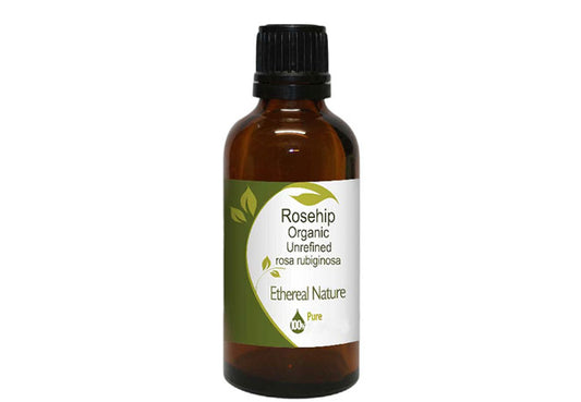 Natural organic rosehip oil unrefined in a glass bottle with a dropper