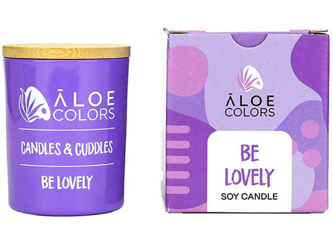 Be Lovely Aloe Colors scented soy candle with caramel and bitter almond in a purple container