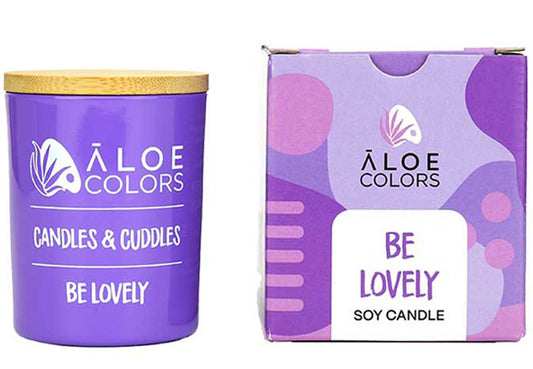 Be Lovely Aloe Colors scented soy candle with caramel and bitter almond in a purple container
